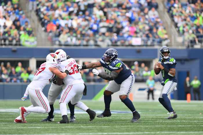Oct 22, 2023; Seattle, Washington, USA; Seattle Seahawks quarterback Geno Smith (7) looks to pass the ball against the Arizona Cardinals during the first half at Lumen Field. 